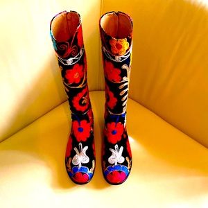 Genuine leather inner, velvet outer hand embroidered knee high boots.